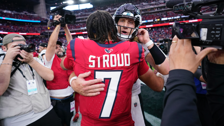 Houston Texans quarterback C.J. Stroud (7) and Jacksonville Jaguars quarterback Trevor Lawrence, center rear, greet each other on the field after their team's NFL football game in Houston, Sunday, Nov. 26, 2023. (AP Photo/Eric Christian Smith)