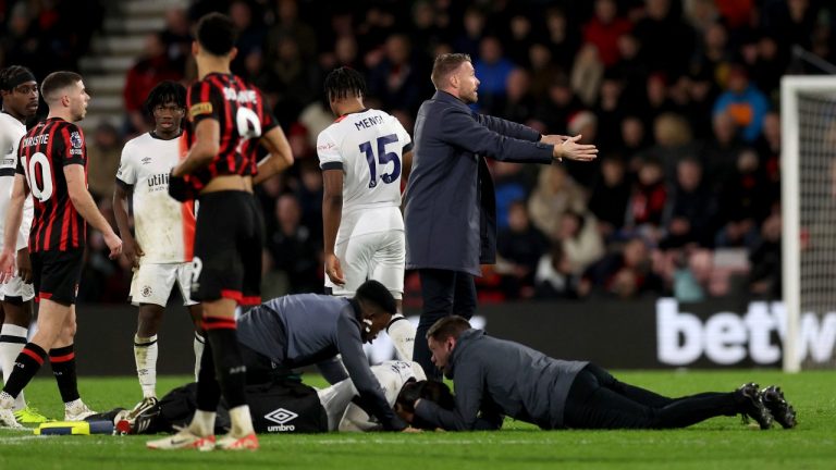 Luton Town manager Rob Edwards gestures he field of play as his player Tom Lockyer receives treatment on the pitch during the English Premier League soccer match between Bournemouth and Luton Town at the Vitality Stadium, in Bournemouth, England, Saturday, Dec. 16, 2023. (AP)
