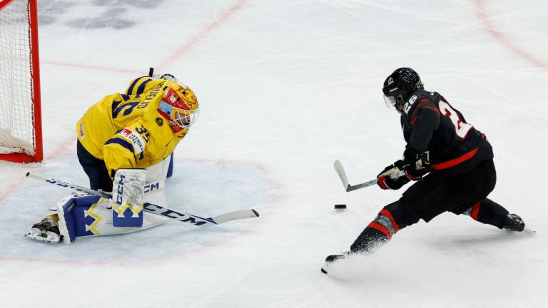 Sweden's Hugo Hävelid, left, and Canada's Matthew Savoie in action during the IIHF World Junior Championship group A ice hockey match between Canada and Sweden at Scandinavium in Gothenburg, Sweden, Friday, Dec. 29, 2023. (Bjoern Larsson Rosvall/TT News Agency via AP)