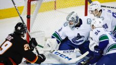 Visiting Canucks hang on to snap Flames’ two-game win streak