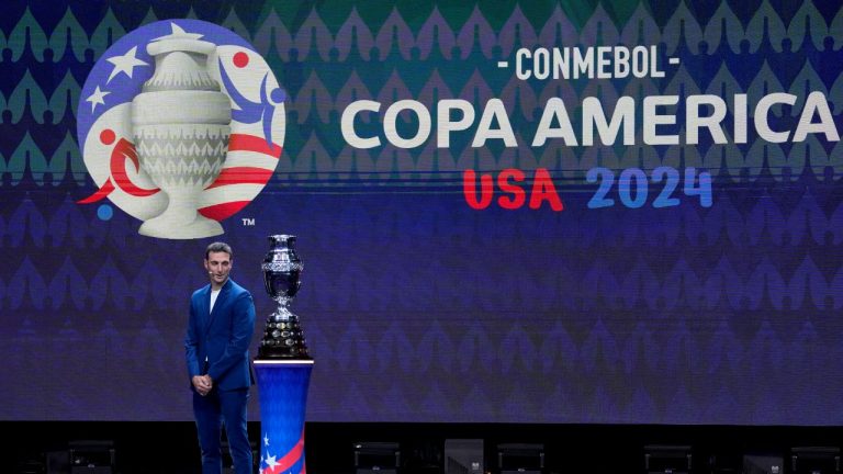 Argentina's soccer coach Lionel Scaloni watches the Copa America trophy during the draw ceremony for the Copa America soccer tournament, Thursday, Dec. 7, 2023, in Miami. (Lynne Sladky/AP)