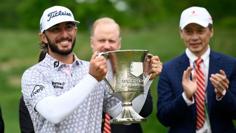 Max Homa holds the trophy after winning the Wells Fargo Championship golf tournament, Sunday, May 8, 2022, at TPC Potomac at Avenel Farm golf club in Potomac, Md. (Nick Wass/AP Photo)