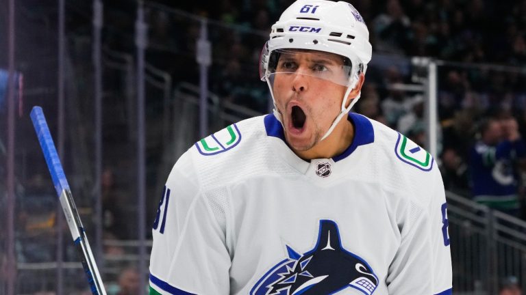 Vancouver Canucks centre Dakota Joshua yells after scoring against the Seattle Kraken during the second period of an NHL hockey game Friday, Nov. 24, 2023, in Seattle. (Lindsey Wasson/AP)