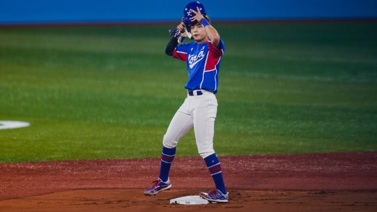 South Korea's Jung Hoo Lee adjusts his helmet after hitting a double during the first inning of a semi-final baseball game against the United States at the 2020 Summer Olympics, Thursday, Aug. 5, 2021, in Yokohama, Japan. (Sue Ogrocki/AP)