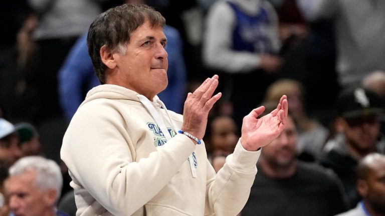Dallas Mavericks team owner Mark Cuban celebrates late in the second half of an NBA basketball game against the Houston Rockets in Dallas, Tuesday, Nov. 28, 2023. (AP Photo/Tony Gutierrez)
