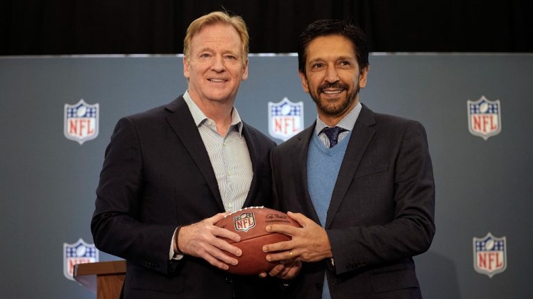 NFL Commisoner Roger Goodell, left, poses with a football with the Mayor of Sao Paulo, Brazil, Ricardo Nunes during a news conference at the NFL owners meeting in Irving, Texas, Wednesday, Dec. 13, 2023. The NFL announced that a regular season game will be played in Sao Paulo. (LM Otero/AP)