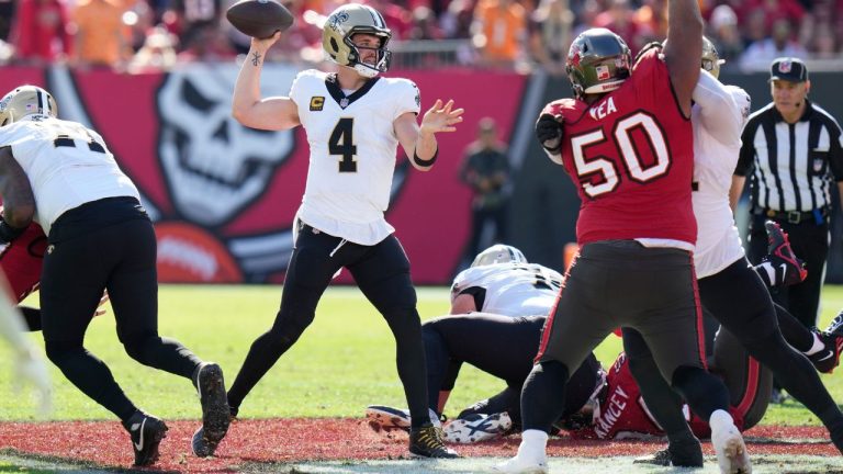 New Orleans Saints quarterback Derek Carr passes under pressure from Tampa Bay Buccaneers defensive tackle Vita Vea in the first half of an NFL football game in Tampa, Fla., Sunday, Dec. 31, 2023. (Chris O'Meara/AP Photo)