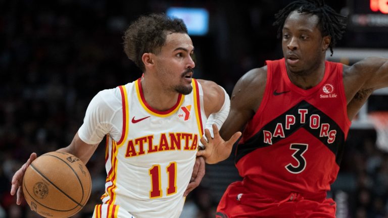 Atlanta Hawks guard Trae Young (11) drives past Toronto Raptors forward OG Anunoby (3). (Frank Gunn/AP)