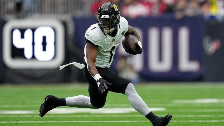 Jacksonville Jaguars running back Travis Etienne Jr. (1) runs against the Houston Texans during an NFL football game Sunday, Nov. 26, 2023, in Houston. (Eric Gay/AP Photo)