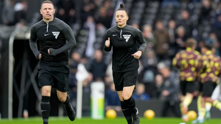 Referee Rebecca Welch jogs during warmup before the English Premier League soccer match between Fulham and Burnley at Craven Cottage stadium in London, Saturday, Dec. 23, 2023. Welch is the first female referee ever to officiate an English Premier League game. (Alastair Grant/AP)