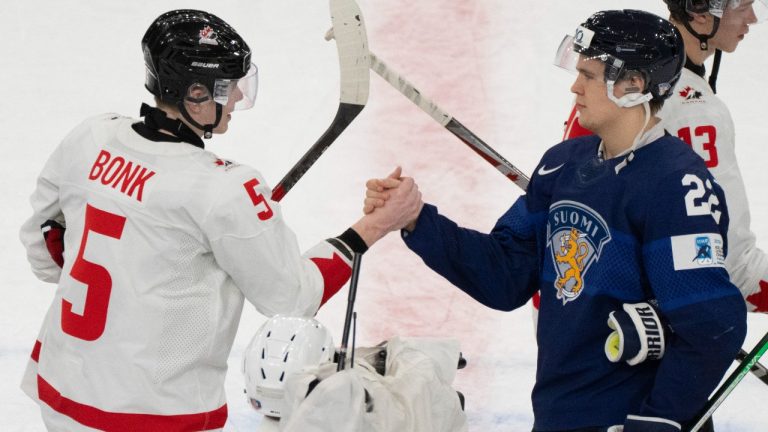 Canada's Oliver Bonk (5) shakes hands with Finland's Kasper Halttunen (22) following thier game at the IIHF World Junior Hockey Championship in Gothenburg, Sweden on Tuesday, Dec 26, 2023. THE CANADIAN PRESS/Christinne Muschi