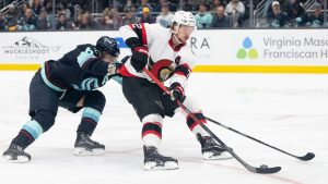 Ottawa Senators defenseman Thomas Chabot, right, skates against Seattle Kraken defenseman Adam Larsson during the first period of an NHL hockey game Thursday, March 9, 2023, in Seattle. (Stephen Brashear/AP)