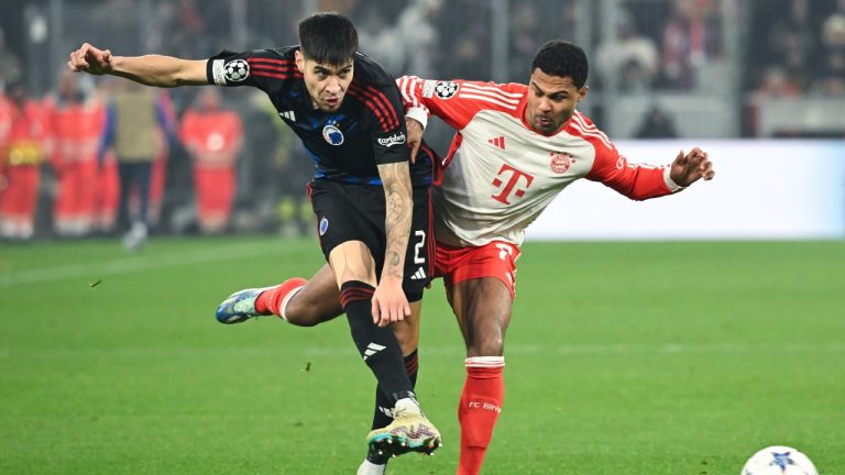 Copenhagen's Kevin Diks, left, and Munich's Serge Gnabry battlef for the ball during the Champions League Group A soccer match between Bayern Munich and FC Copenhagen at Allianz Arena, Munich, Germany, Wednesday Nov. 29, 2023. (Sven Hoppe/dpa via AP)
