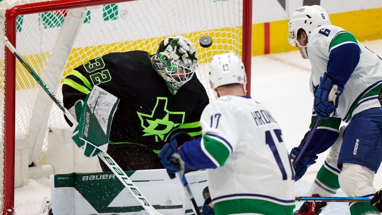 Dallas Stars goaltender Matt Murray (32) defends against Vancouver Canucks attackers Filip Hronek (17) and Brock Boeser (6) during the second period of an NHL hockey game in Dallas, Saturday, March 25, 2023. (LM Otero/AP Photo)
