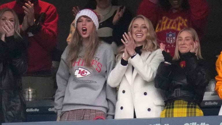 Taylor Swift, center left, reacts with Brittany Mahomes, center right, during the first half of an NFL football game (Charles Krupa/AP)
