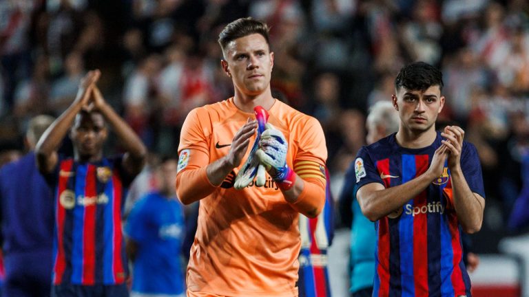 Barcelona's goalkeeper Marc-Andre ter Stegen, centre, Ansu Fati, left and Pedri applaud the fans at the end of a Spanish La Liga soccer match between Rayo Vallecano and Barcelona at the Vallecas stadium in Madrid, Spain, Wednesday, April 26, 2023. (Pablo Garcia/AP)