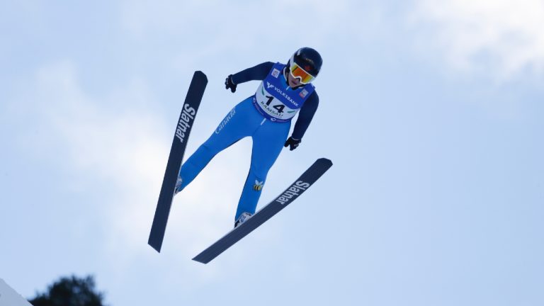 Canadian ski jumper Abigail Strate started 2024 off with a World Cup silver medal Monday. Strate soars through the air during the FIS Ski Jumping Women's World Cup in Ramsau, Austria, Friday, Dec. 17, 2021. (AP/Lisa Leutner/CP)