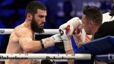Beterbiev knocks out Smith to retain light heavyweight belts