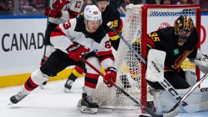 Vancouver Canucks goaltender Thatcher Demko (35) stops New Jersey Devils' Jesper Bratt (63) during the second period of an NHL hockey game in Vancouver on Tuesday, Dec. 5, 2023. (Ethan Cairns/CP)