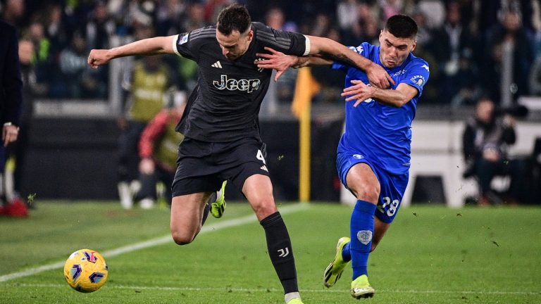 Juventus' Federico Gatti, left and Empoli's Nicolò Cambiaghi vie for the ball, during the Italian Serie A soccer match between Juventus and Empoli, at the Allianz Stadium, in Turin, Italy, Saturday, Jan. 27, 2024. (Marco Alpozzi/LaPresse via AP) 