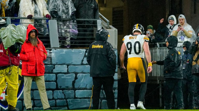 Pittsburgh Steelers linebacker T.J. Watt walks with medical staff to the lockers during the second half of an NFL football game against the Baltimore Ravens, Saturday, Jan. 6, 2024 in Baltimore. (Matt Rourke/AP)