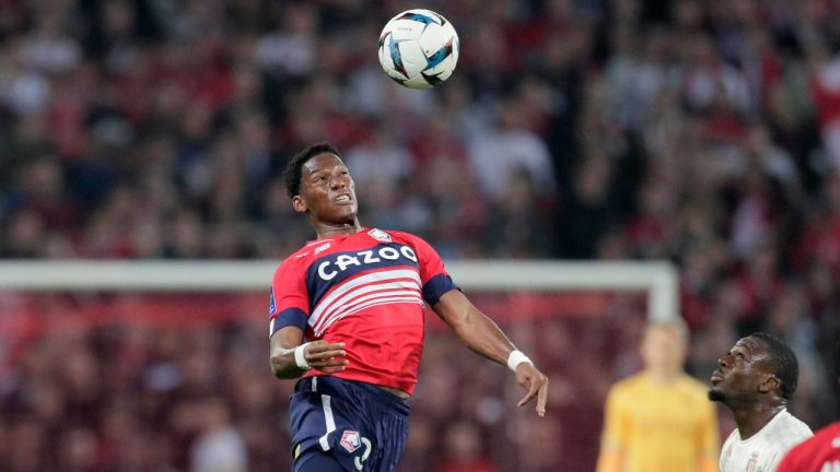 Lille's Jonathan David heads the ball during the French League 1 soccer match on Sunday, Oct. 23, 2022. (Michel Spingler/AP)