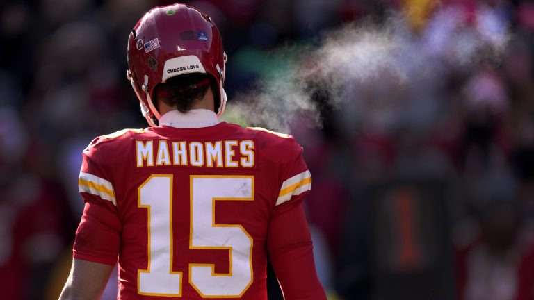 Steam from Kansas City Chiefs quarterback Patrick Mahomes' breath is seen during the first half of an NFL football game against the Seattle Seahawks Saturday, Dec. 24, 2022, in Kansas City, Mo. (AP Photo/Charlie Riedel)