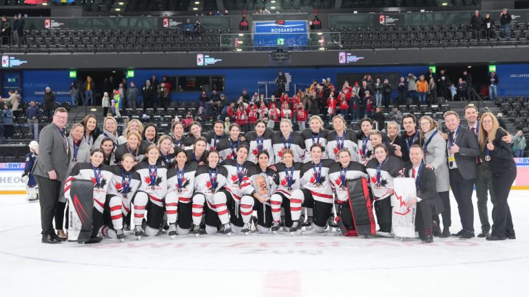 Team Canada pose with the bronze medal trophy following a 8-1 win against Finland during Bronze Medal Game action at the 2024 IIHF Ice Hockey U18 Women’s World Championship on Sunday January 14, 2024 in Zug, Switzerland. (HO-International Ice Hockey Federation-Andre Ringuette/CP)