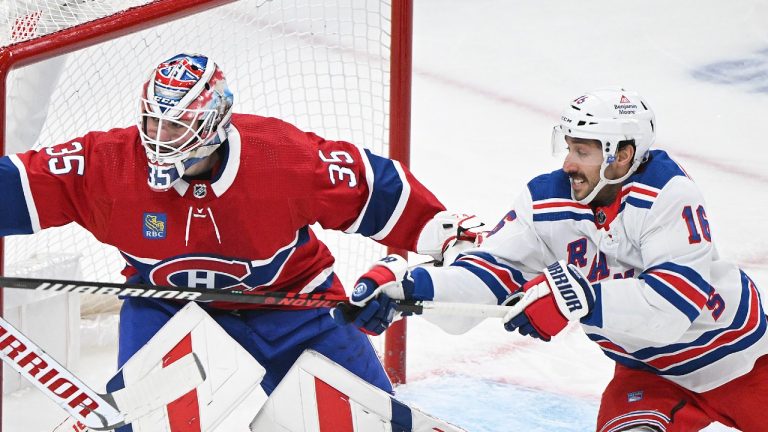 New York Rangers' Vincent Trocheck (16) moves in on Montreal Canadiens goaltender Sam Montembeault during second period NHL hockey action in Montreal, Saturday, January 6, 2024. (CP/Graham Hughes)