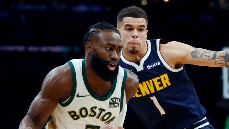 Boston Celtics' Jaylen Brown (7) drives past Denver Nuggets' Michael Porter Jr. (1) during the first half of an NBA basketball game, Friday, Jan 19, 2024, in Boston. (AP/Michael Dwyer)