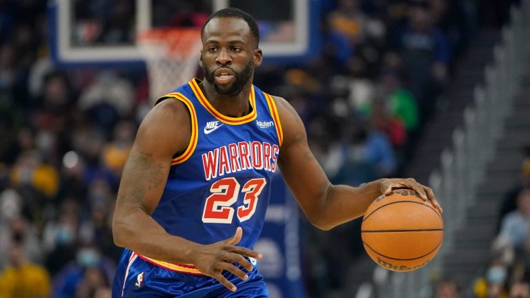 Golden State Warriors forward Draymond Green (23) dribbles the ball up the court against the Memphis Grizzlies during the first half of an NBA basketball game. (Jeff Chiu/AP)