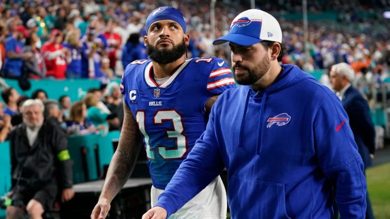 Buffalo Bills wide receiver Gabe Davis is escorted off the field during the first half of an NFL football game against the Miami Dolphins, Sunday, Jan. 7, 2024, in Miami Gardens, Fla. (Lynne Sladky/AP)