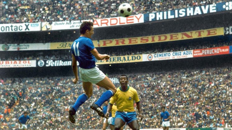 FILE - Italian forward Gigi Riva, heads the ball as Brazilian star Pele looks on during the World Cup final match at Azteca Stadium, Mexico City, Mexico, June 21, 1970. (Carlo Fumagalli/AP)
