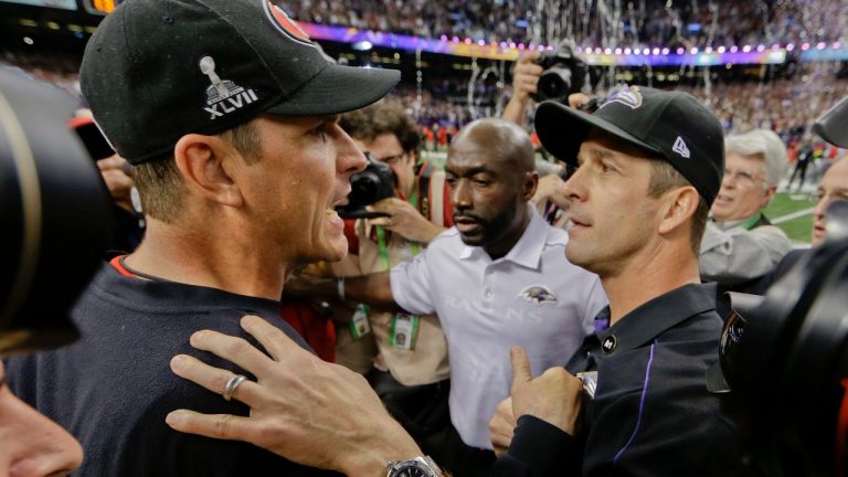 San Francisco 49ers head coach Jim Harbaugh, left, greets Baltimore Ravens head coach John Harbaugh after the Ravens defeated the 49ers 34-31 in the NFL Super Bowl XLVII football game, Sunday, Feb. 3, 2013, in New Orleans. (AP Photo/Dave Martin)