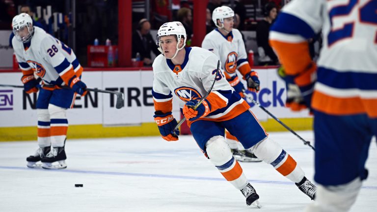 New York Islanders center Kyle Maclean (32) warms up before an NHL hockey game against the Chicago Blackhawks, Friday, Jan. 19, 2024, in Chicago. His father, John Maclean, is the Islanders' assistant coach. (Matt Marton/AP)