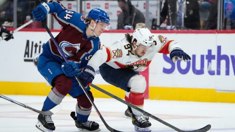 Colorado Avalanche left wing Joel Kiviranta, left, and Florida Panthers left wing Ryan Lomberg, right, pursue the puck in the first period of an NHL hockey game Saturday, Jan. 6, 2024, in Denver. (David Zalubowski/AP)