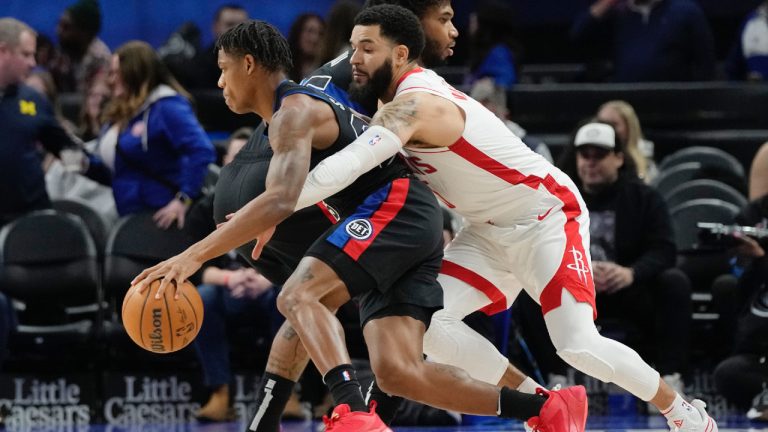 Houston Rockets guard Fred VanVleet (23) reaches in on Detroit Pistons guard Marcus Sasser during the first half of an NBA basketball game, Friday, Jan. 12, 2024, in Detroit. (Carlos Osorio/AP)