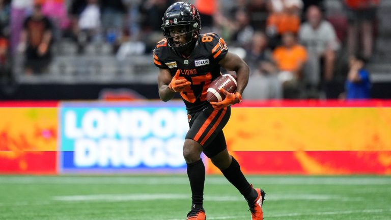 B.C. Lions' Terry Williams (87) celebrates after returning a missed Ottawa Redblacks field goal attempt for a touchdown. (Darryl Dyck/CP)