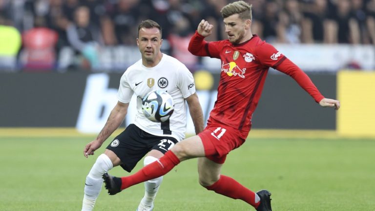Leipzig's Timo Werner, right, challenges for the ball with Frankfurt's Mario Goetze during the German soccer cup, DFB Pokal, final match between RB Leipzig and Eintracht Frankfurt at Olympiastadion in Berlin, Germany, Saturday, June 3, 2023. (Andreas Gora/AP)