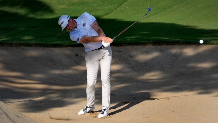 Keegan Bradley hits from the bunker on the 16th fairway during the third round of the Sony Open golf event, Saturday, Jan. 13, 2024, at Waialae Country Club in Honolulu. (Matt York/AP)