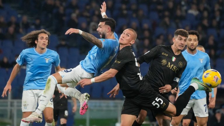 Lazio's Taty Castellanos, left, and Napoli's Leo Ostigard vie for the ball during the Serie A soccer match between Lazio and Napoli at Rome's Olympic Stadium, Sunday, Jan. 28, 2024. (Gregorio Borgia/AP)