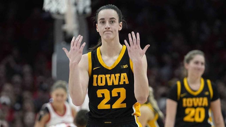 Iowa guard Caitlin Clark gestures in the first half of an NCAA college basketball game against Ohio State. (Sue Ogrocki/AP)