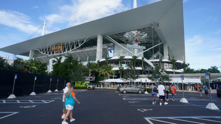Football fans arrive at Hard Rock Stadium before a NFL preseason football game between the Miami Dolphins and the Philadelphia Eagles, Saturday, Aug. 27, 2022, in Miami Gardens, Fla. Police in South Florida say a man fatally shot a 30-year-old Buffalo Bills fan during an altercation outside Hard Rock Stadium after the Bills defeated the Miami Dolphins in the final regular season game, Sunday Jan. 7, 2024. (Wilfredo Lee/AP File phtoo)