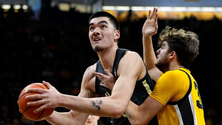 Purdue center Zach Edey drives to the basket past Iowa forward Owen Freeman, right, during the first half of an NCAA college basketball game, Saturday, Jan. 20, 2024, in Iowa City, Iowa. (Charlie Neibergall/AP Photo)