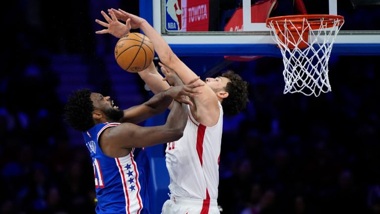 Philadelphia 76ers' Joel Embiid, left, cannot get a shot past Houston Rockets' Alperen Sengun during the second half of an NBA basketball game, Monday, Jan. 15, 2024, in Philadelphia. (Matt Slocum/AP)