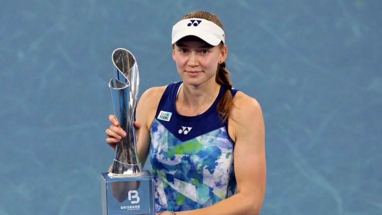 Elena Rybakina of Kazakhstan poses with the trophy after she won her final match against Aryna Sabalenka of Belarus during the Brisbane International tennis tournament in Brisbane, Australia, Sunday, Jan. 7, 2024. (Tertius Pickard/AP)