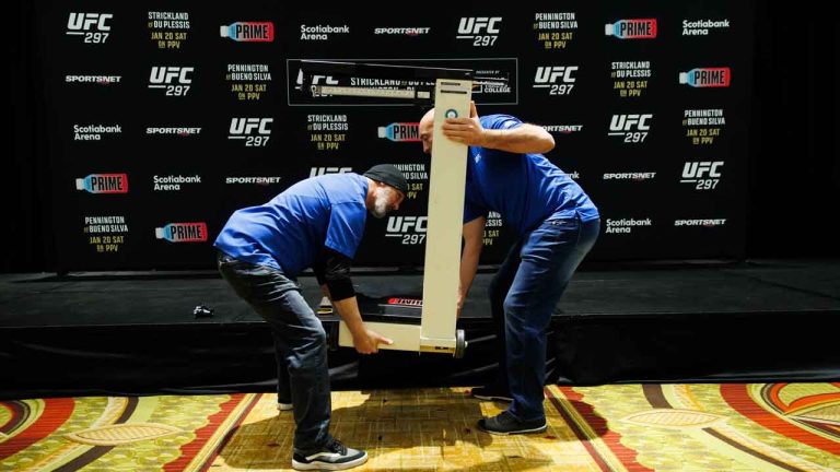 Workers move a scale used for UFC fighter weigh-ins, ahead of UFC 297 in Toronto. (Cole Burston/THE CANADIAN PRESS)