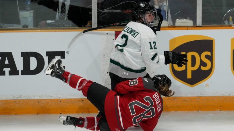 Boston's Taylor Wenczkowski collides with Ottawa's Amanda Boulier at centre ice during third period PWHL action, Wednesday, January 24, 2024 in Ottawa. (Adrian Wyld/CP)