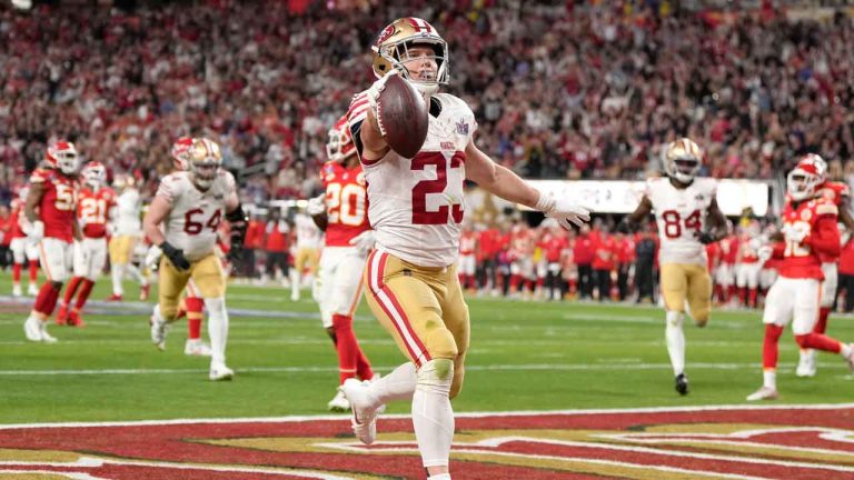 San Francisco 49ers running back Christian McCaffrey (23) runs in a touchdown during the first half of the NFL Super Bowl 58 football game. (Doug Benc/AP)