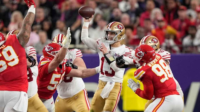 San Francisco 49ers quarterback Brock Purdy (13) throws under pressure from Kansas City Chiefs defensive end George Karlaftis (56) during the first half of the NFL Super Bowl 58 football game. (Brynn Anderson/AP)